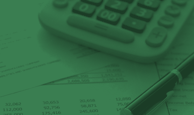 Calculator and pen with a spreadsheet