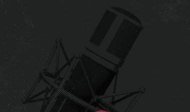 Podcast microphone with a red arrow pointing upward.