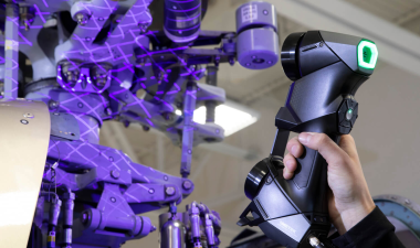 Close up of a black scan tool being used.