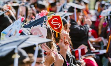 Graduate holds Stan State Shield