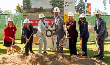 Seven Stan State pictured posing for a group photo with shovels in hand.