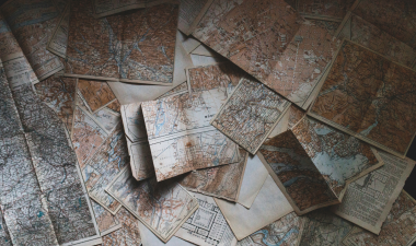 Maps scattered on a table