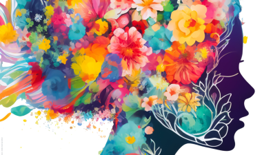Silhouette of a woman's head filled with vibrant, colorful flowers and foliage, set against a white background.
