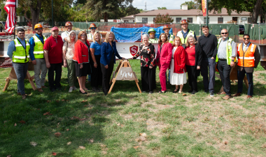 Stockton Campus faculty and staff and Otto Construction with structural beam