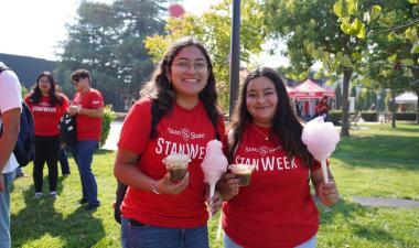 Two students wearing StanWeek shirts