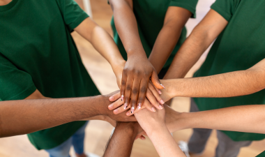 Volunteers holding hands