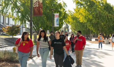 Students walking outdoors at the main campus in Turlock.