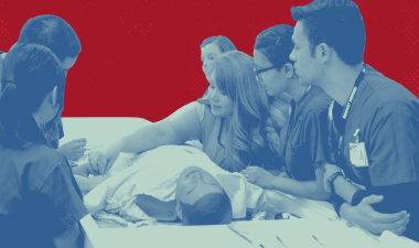 Nursing instructor demonstrating skills to students.