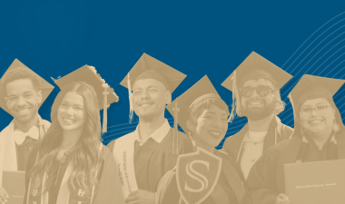 Stan State graduates in their cap and gown.