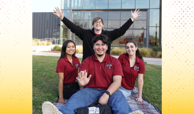 Four students in front of the University Student Center