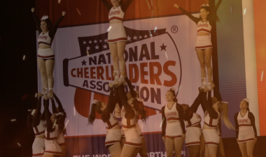 Cheer Team in a stunt formation on stage