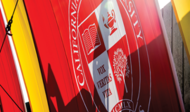 A closeup of a Stanislaus State banner on the Commencement stage