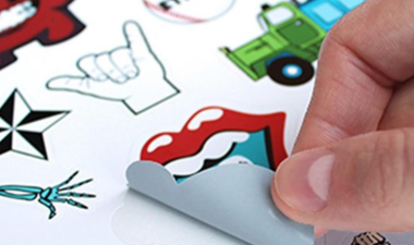 Hand peeling off stickers