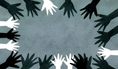 Hands of different skin tones forming a circle