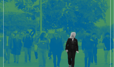 President walking with students