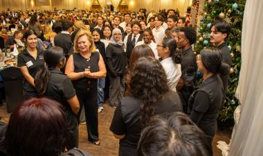 President Britt Rios-Ellis with student volunteers at Legacy of Hope.