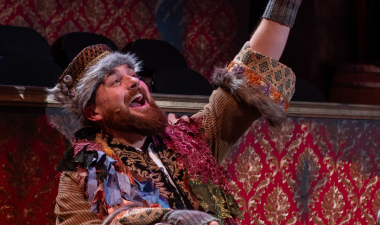 A male actor from the comet musical production is seen on stage