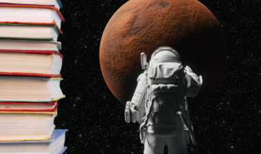Stack of books next to an astronaut