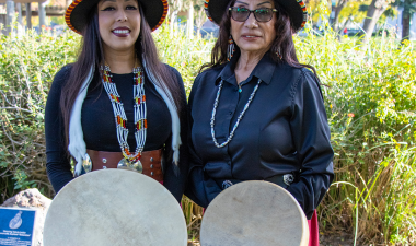 Two members of Sacred Rising Voices drumming circle