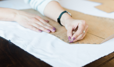 A person using a sewing pattern