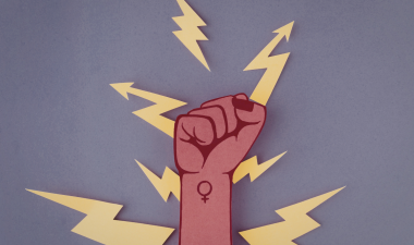 A fist with the female icon written on it