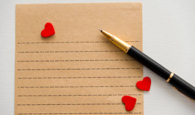 A lined piece of paper and a pen