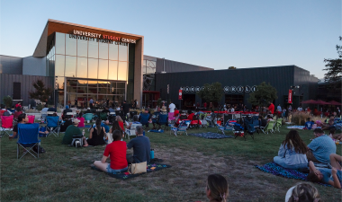 Students sitting on the Student Center lawn