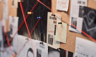 Pin board with crime solving material