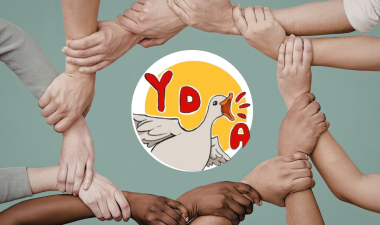 People holding hands around the YDSA logo