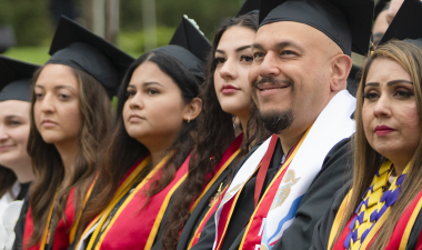 Graduates in academic regalia at Commencement