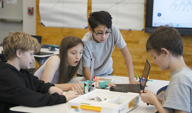 students working on coding lego project