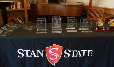 Table with faculty awards on display
