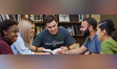 A group of five students sit at Learning Commons-Spring Into Study event
