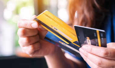 person holding credit cards