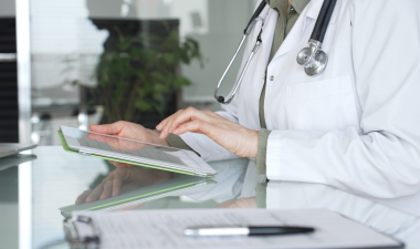 Person in healthcare with tablet in an office
