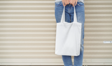 Person holding tote bag