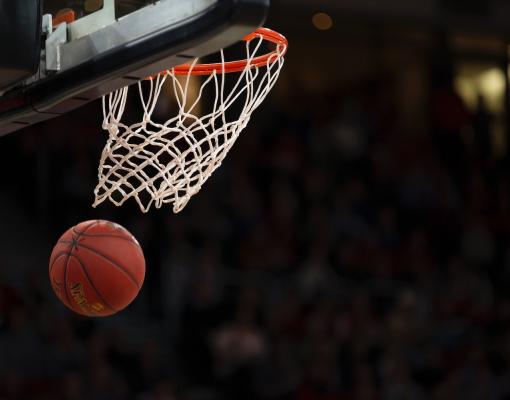 Basketball going through hoop.