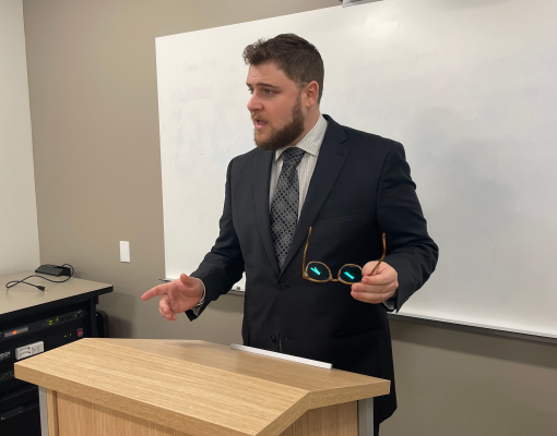 Student Presenting at a podium in Moot Court Competition