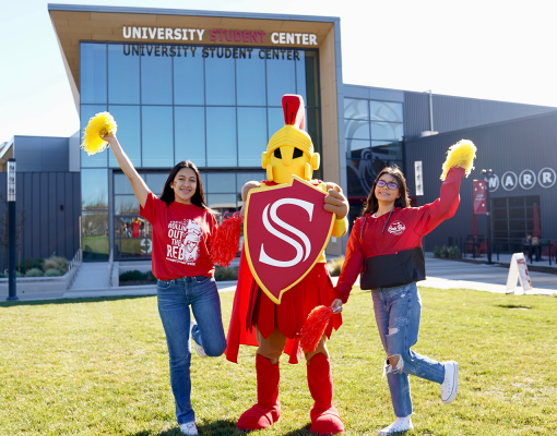 Titus with students on the Warrior Lawn