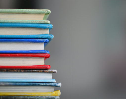 books stacked on top of each other.