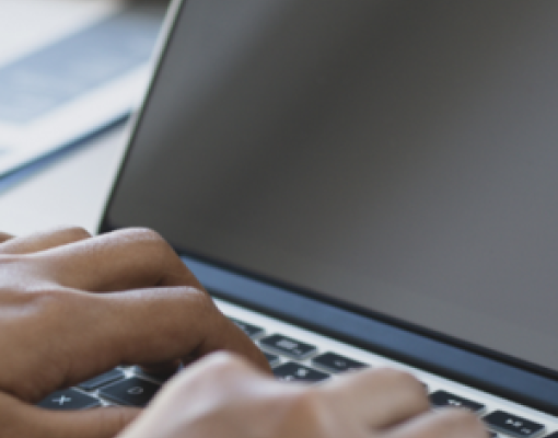 Person typing on a computer