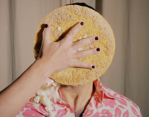 a pie being thrown in a persons face