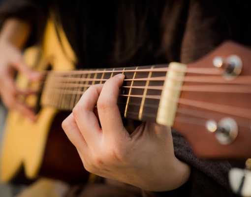 a person playing guitar