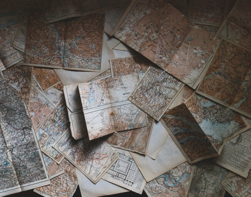 Maps scattered on a table