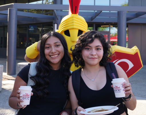 Titus and Students holding coffee and pancakes