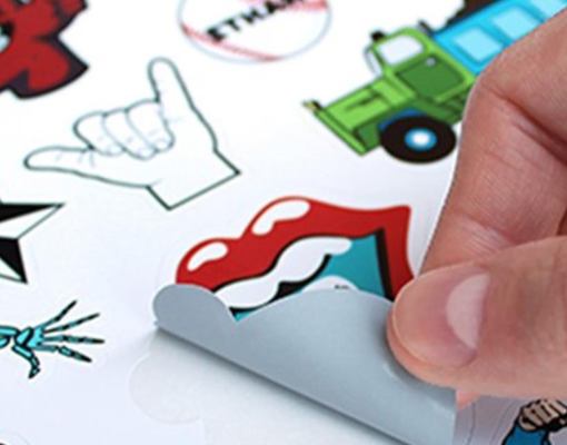 Hand peeling off stickers