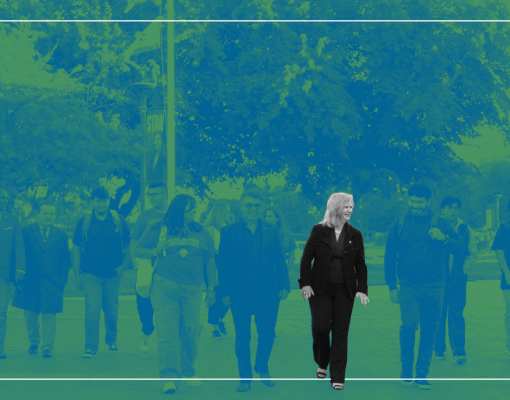 President walking with students