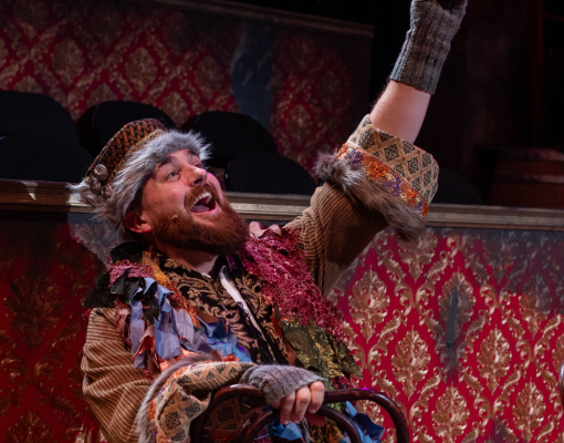 A male actor from the comet musical production is seen on stage