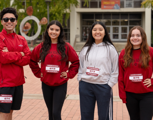 Four student participants from the Homecoming 5k in 2025 are seen in a group photo