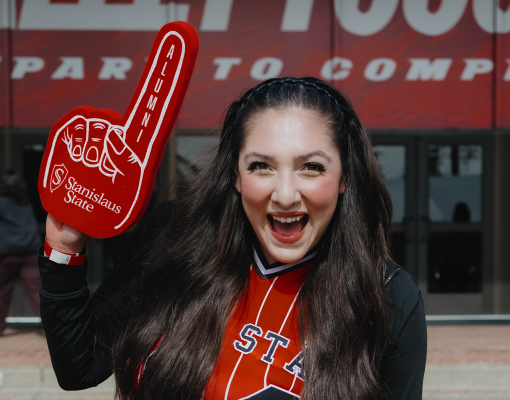Student cheering with foam finger